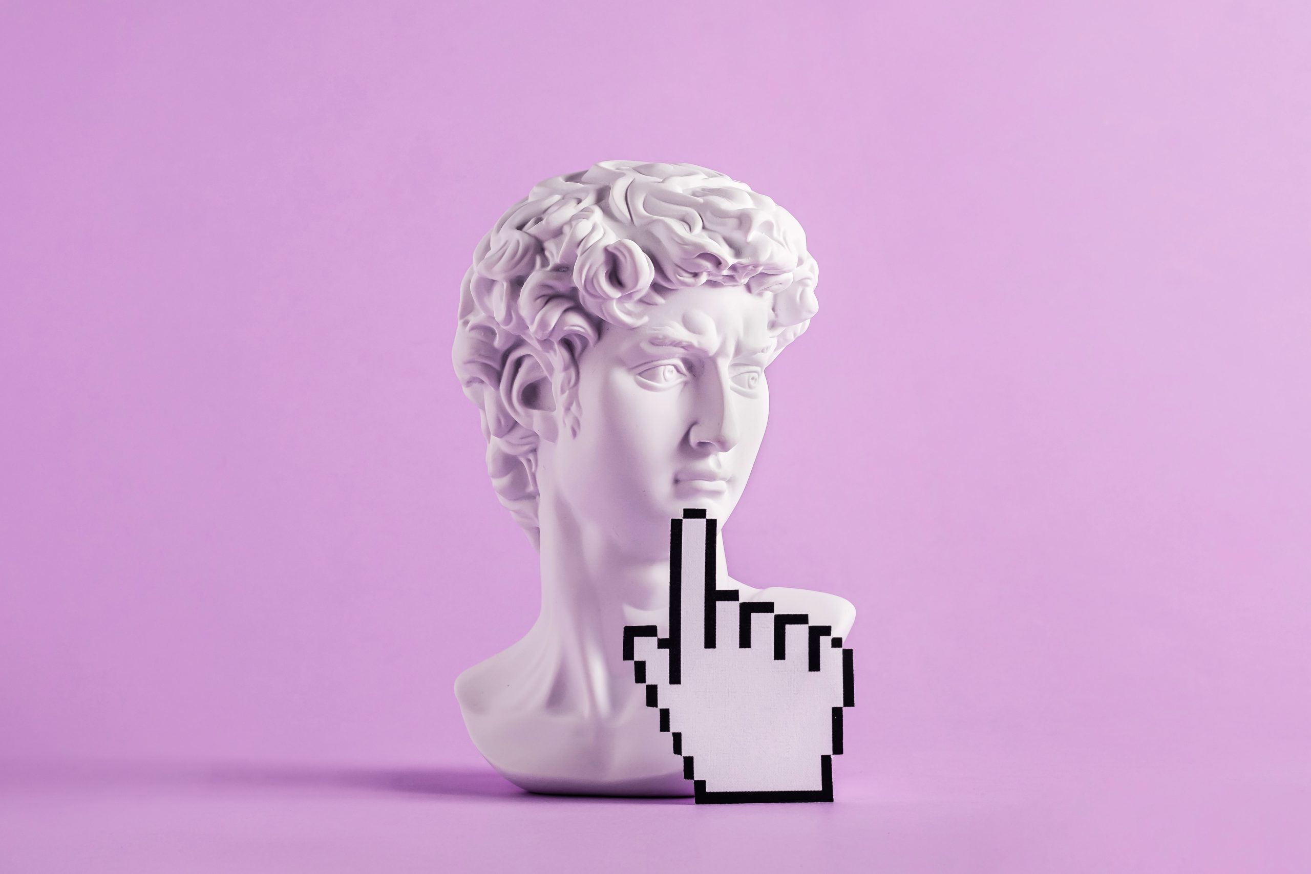 Historical antique statue of david's head and mouse cursor with finger. Concept of modern art and vaporwave and cyberpunk